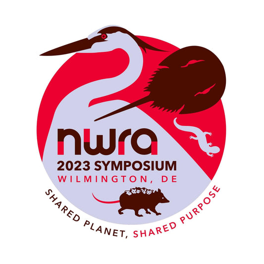 The logo for the National Wildlife Rehabilitators Association Symposium 2023. The logo features an illustration of a heron, horseshoe crab, a salamander, and a mama opossum carrying babies on her back.