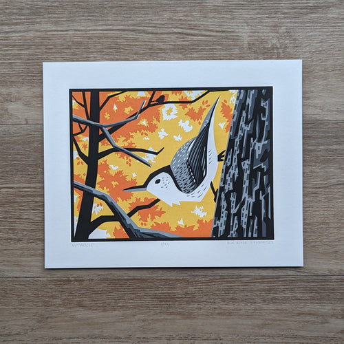 A screen print of an illustration of a nuthatch perched on the side of a tree with yellow and orange fall foliage behind it.