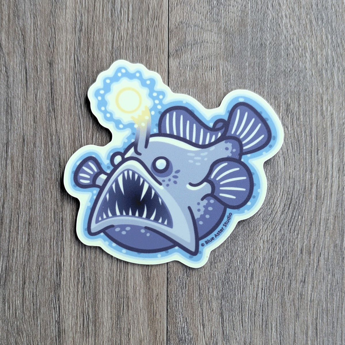 Sticker of an anglerfish with shining lure