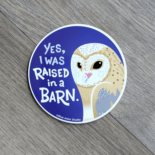 Round vinyl sticker with illustration of a barn owl and the words Yes I Was Raised In A Barn.