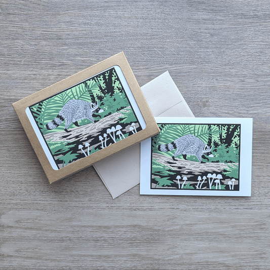 A pack of eight raccoon cards with envelopes.