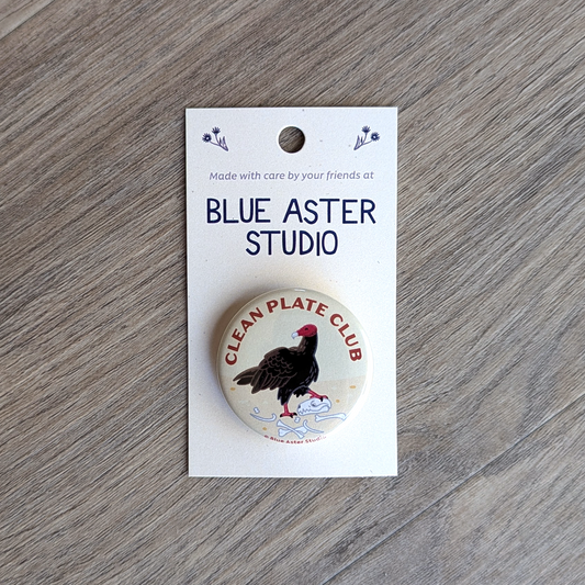 A 1.5 inch button of a turkey vulture with the text "Clean Plate Club."