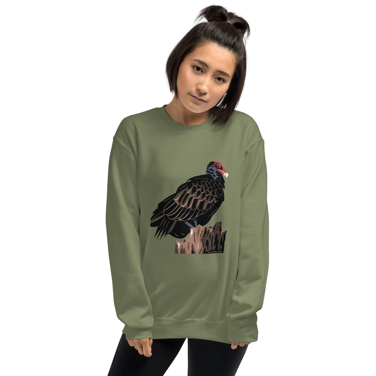 A woman wearing the green majestic turkey vulture sweatshirt.