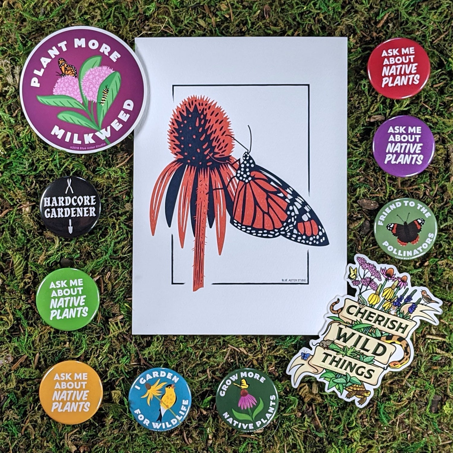 Native plant and gardening buttons, stickers, and prints. The buttons have messages such as "ask me about native plants," "friend to the pollinators," and "I garden for wildlife." The stickers include a "Plant More Milkweed" and "Cherish Wild Things."