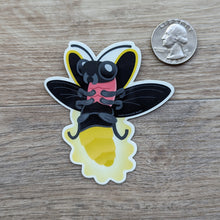 Load image into Gallery viewer, The firefly sticker sitting next to a USD quarter to show scale.