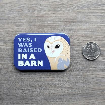 The barn owl magnet sitting next to a USD quarter to show scale.