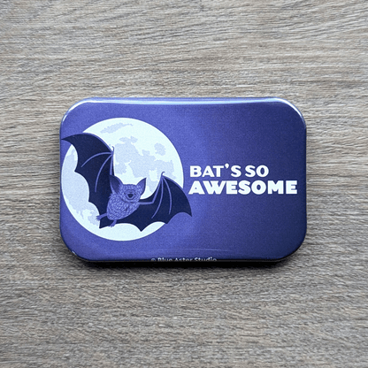 A 2 inche by 3 inch refrigerator magnet featuring an illustration of a cute bat flying in front of a full moon with the words Bat's So Awesome.