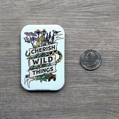 The Cherish Wild Things magnet sitting next to a USD quarter to show scale.