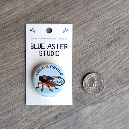 The cicada button with a USD quarter for scale.