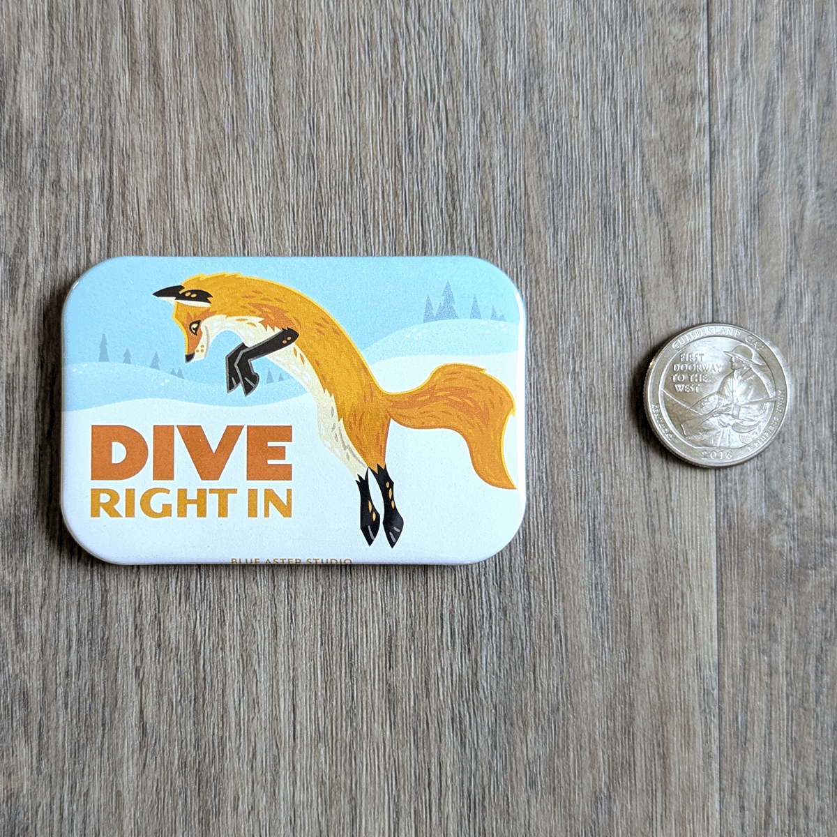 The fox magnet with a USD quarter to show scale. Measures 2 inches by three inches.