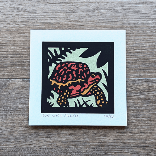 An original mini screen print of a box turtle printed in four colors.