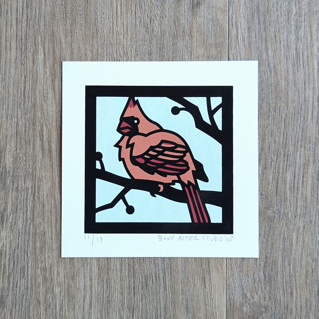 A mini screen print of a female cardinal in four colors.