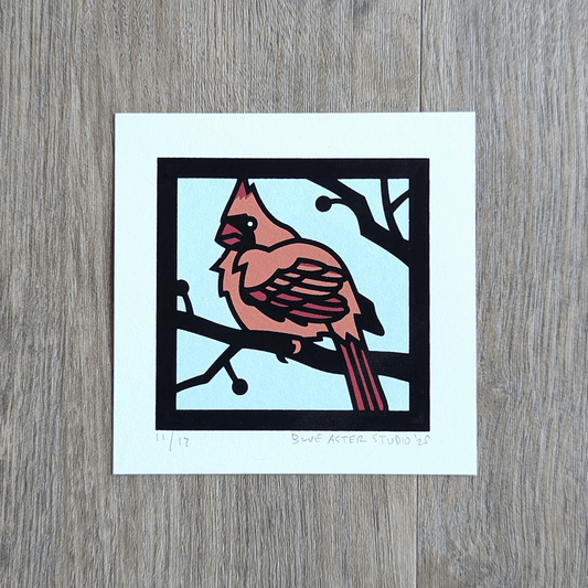 A mini screen print of a female cardinal in four colors.