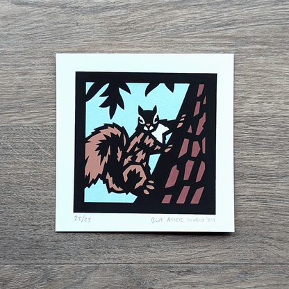 A screen print of a squirrel on a tree.