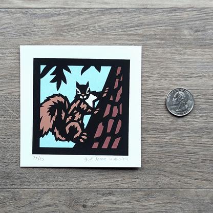 The squirrel mini screen print with a USD quarter for scale.