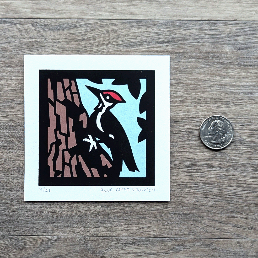 The woodpecker mini screen print with a quarter for scale.