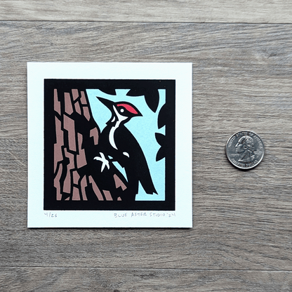 The woodpecker mini screen print with a quarter for scale.