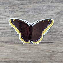 Load image into Gallery viewer, Sticker art of a brown butterfly with yellow wing edges lined with blue spots