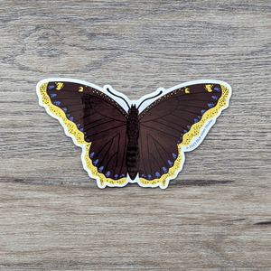 Sticker art of a brown butterfly with yellow wing edges lined with blue spots