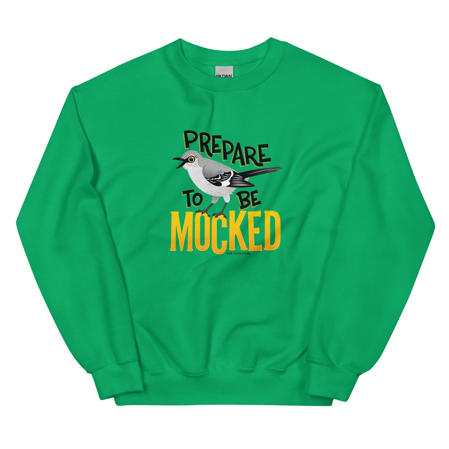 A green sweatshirt with the text "prepare to be mocked" with an illustrated mockingbird perched within it