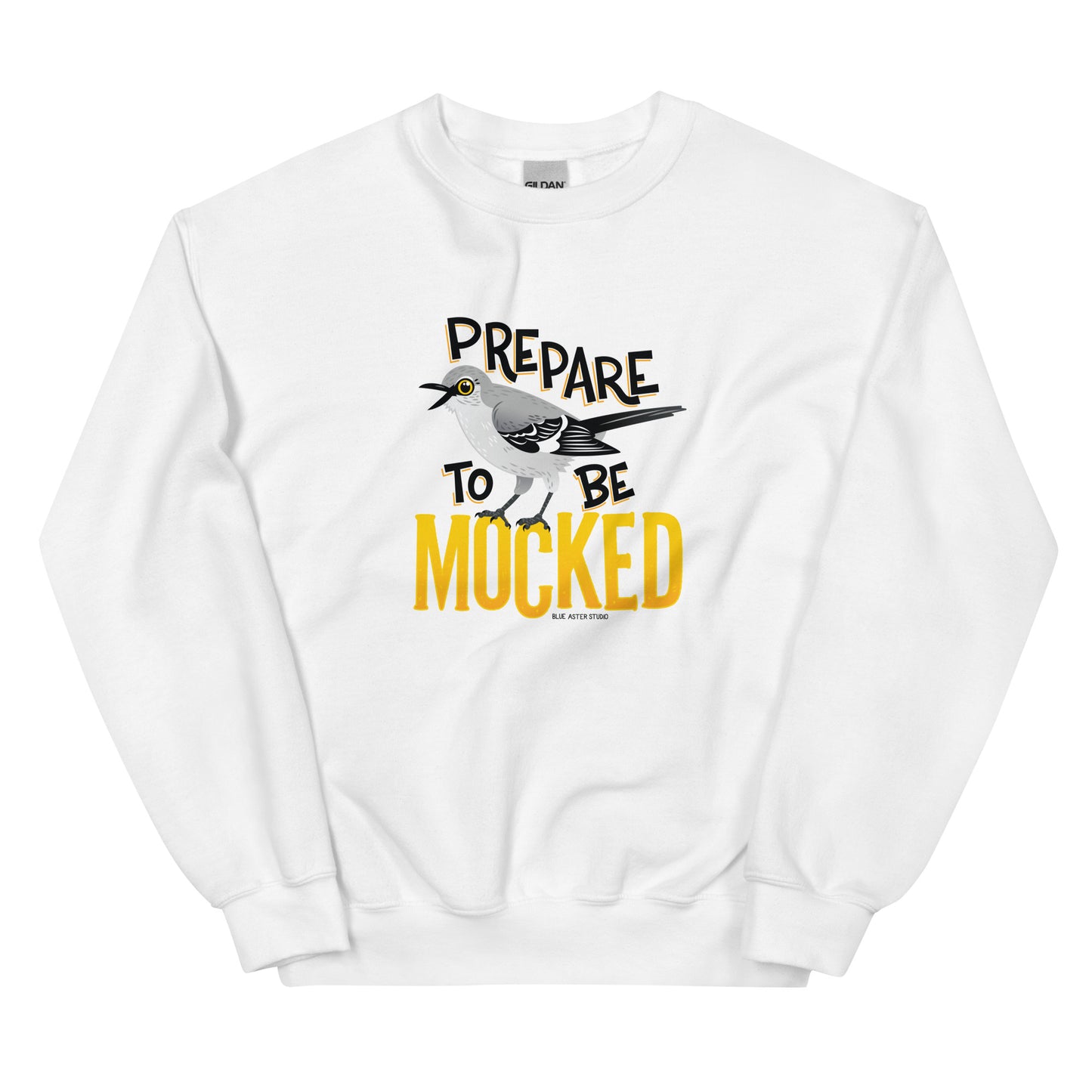 A white sweatshirt with the text "prepare to be mocked" with an illustrated mockingbird perched within it