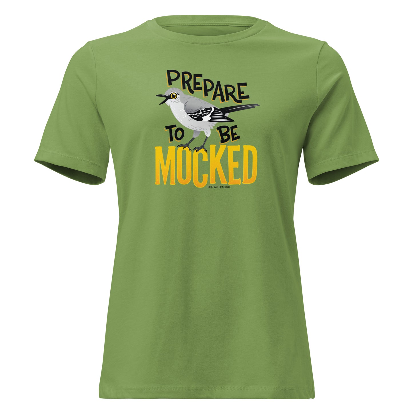 A green women's cut tee shirt with the text "prepare to be mocked" with an illustrated mockingbird perched within it