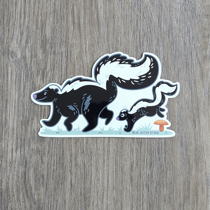 Sticker of an illustration of mama skunk with a baby skunk following behind.