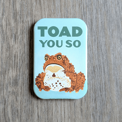 A rectangular magnet with an illustration of a grumpy toad and the text "Toad You So"