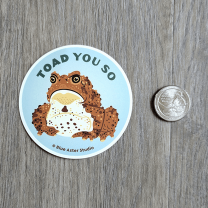 The toad sticker sitting next to a USD quarter for scale.