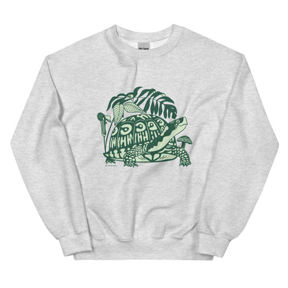 A light gray crew neck sweatshirt with a design of a box turtle surrounded by woodland plants.