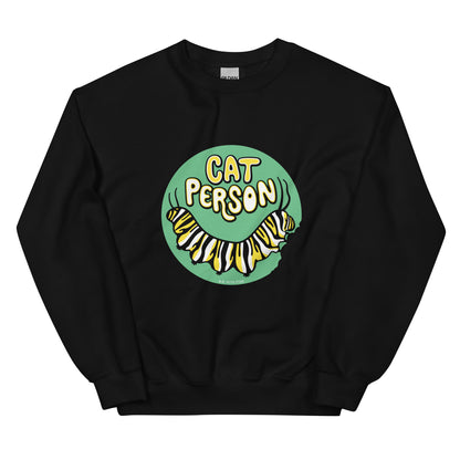 A black sweatshirt with a green circular design of the text Cat Person above a monarch caterpillar, which is munching at the circle.
