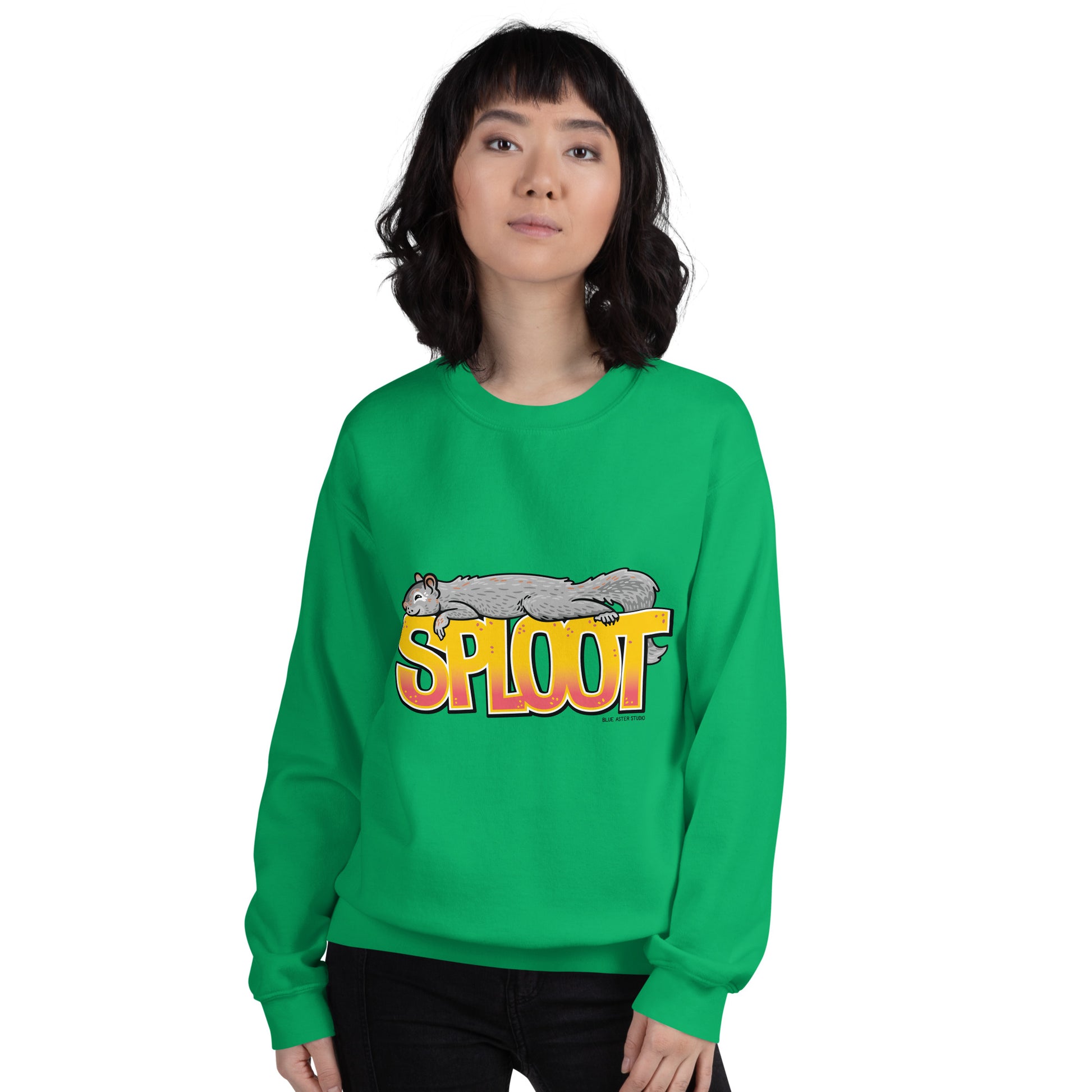 A woman wearing the squirrel sploot sweatshirt in green.