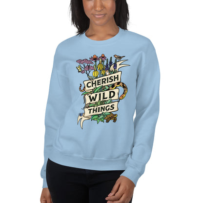A model wearing a light blue Cherish Wild Things sweatshirt.