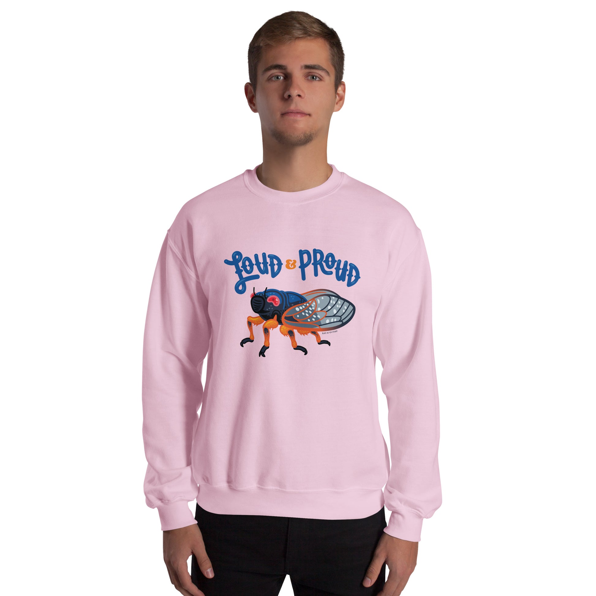 A man modeling the unisex cicada sweatshirt in light pink.