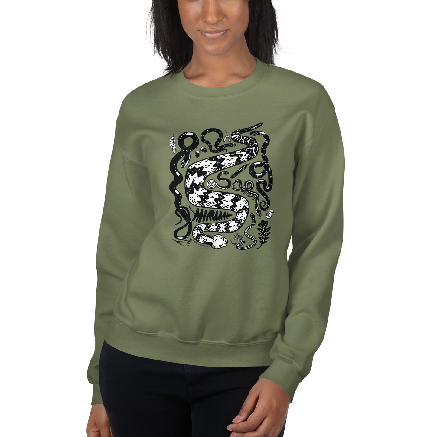 A woman modeling the green seven snakes sweatshirt.