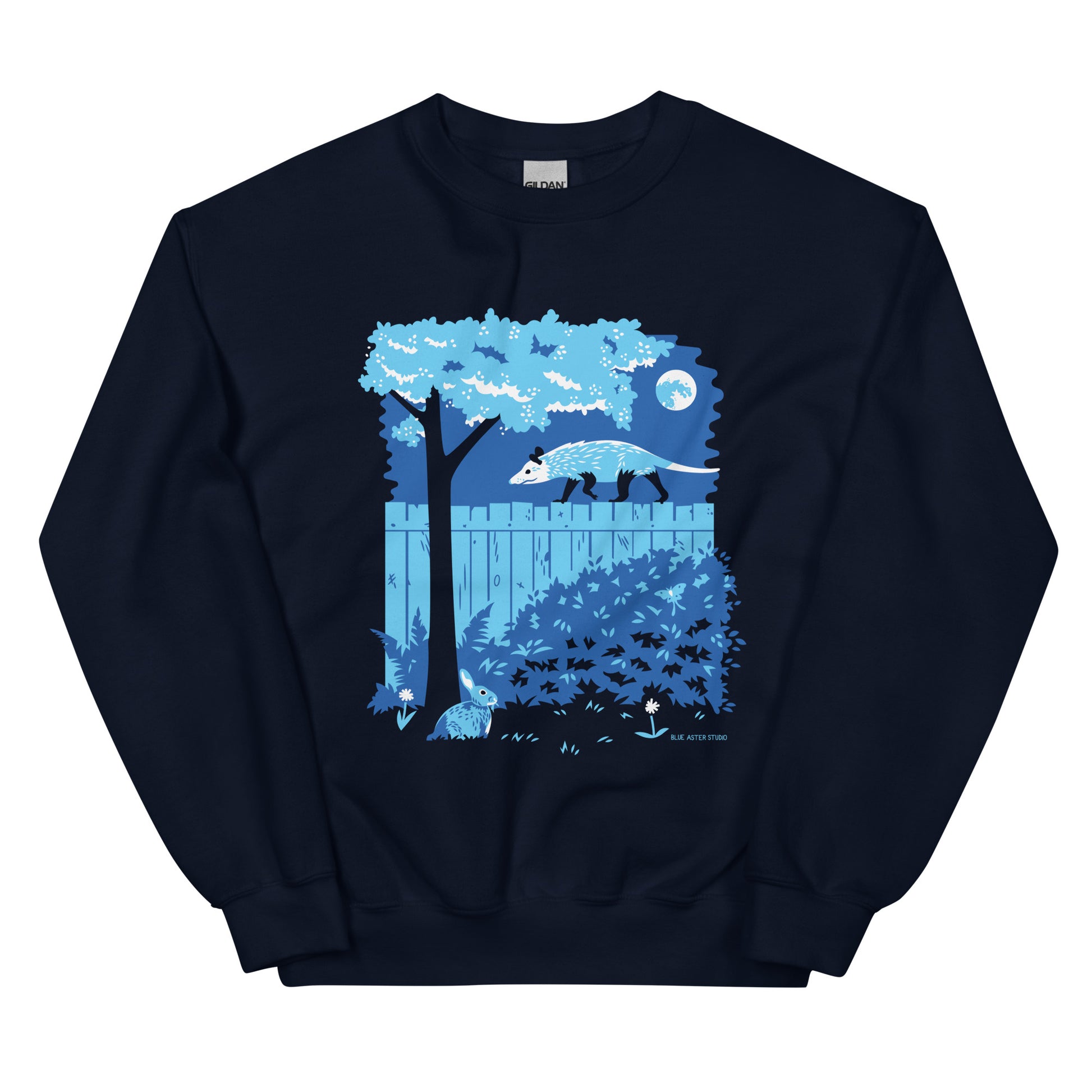 A navy blue sweatshirt with an illustration of an opossum walking on a moonlit fence with a rabbit and a luna moth in the yard below.