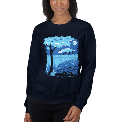 A model wearing the navy blue illustrated opossum and bunny night time backyard sweatshirt.
