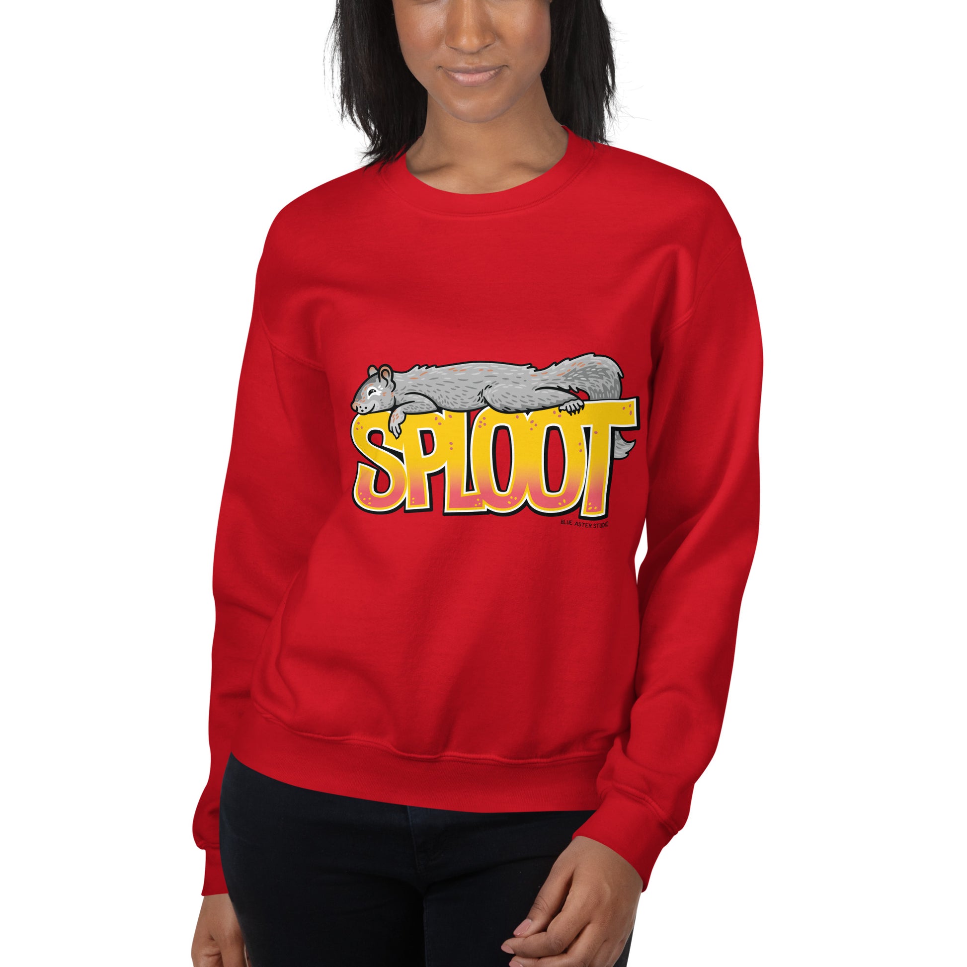 A woman modeling the unisex squirrel sploot sweatshirt in red.