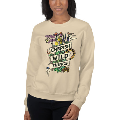 A model wearing a tan Cherish Wild Things sweatshirt.