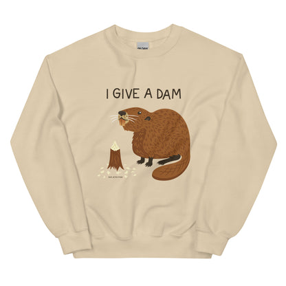 A sand colored sweatshirt with an illustration of a beaver and the words I Give A Dam printed on the front.