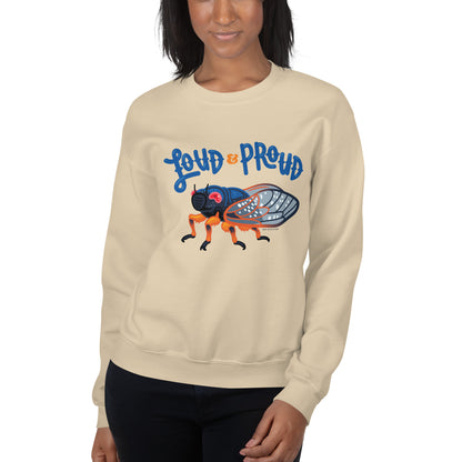 A woman modeling the loud and proud cicada sweatshirt in the sand color.