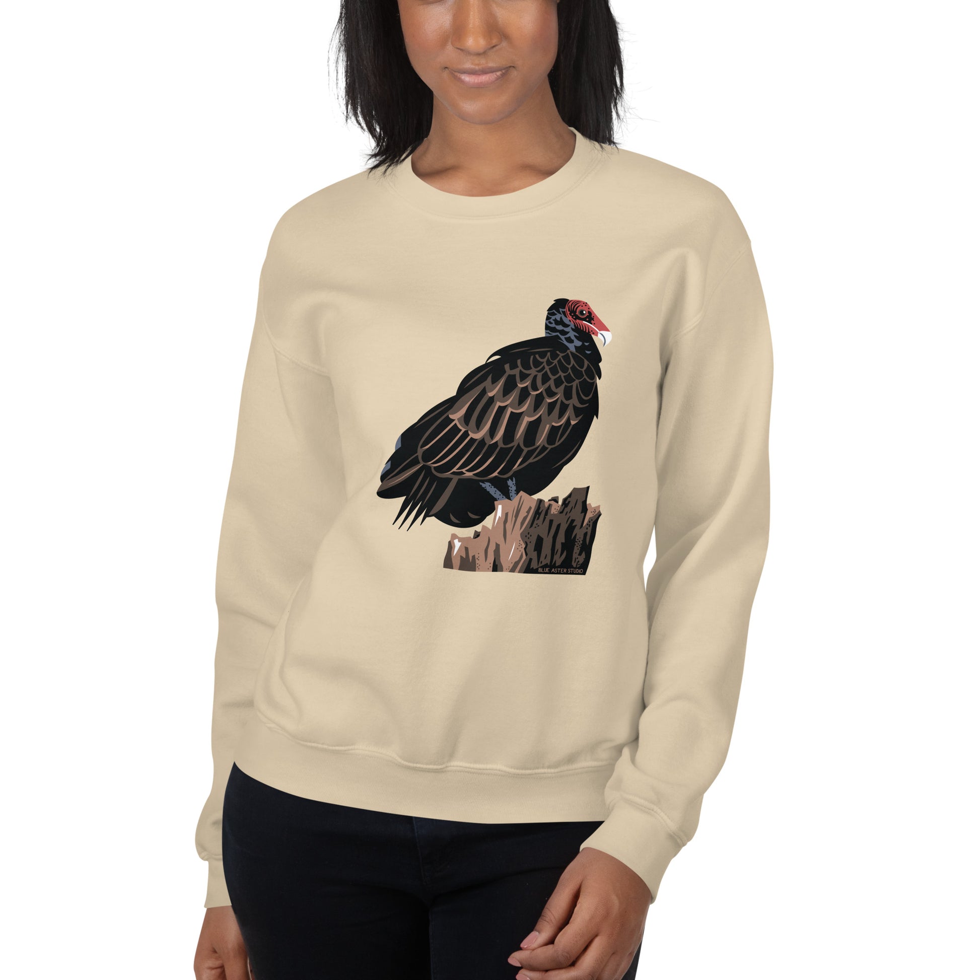 A model wearing the sand colored majestic turkey vulture sweatshirt.