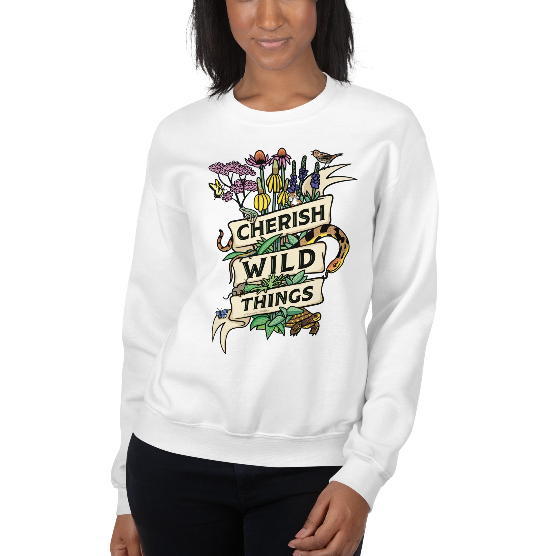 A model wearing a white Cherish Wild Things sweatshirt.