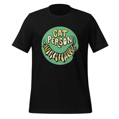 A black t-shirt with a green circular design of the text Cat Person above a monarch caterpillar, which is munching at the circle.