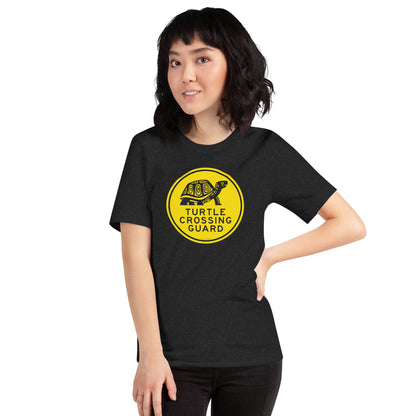 A woman modeling the heather grey turtle crossing guard shirt.