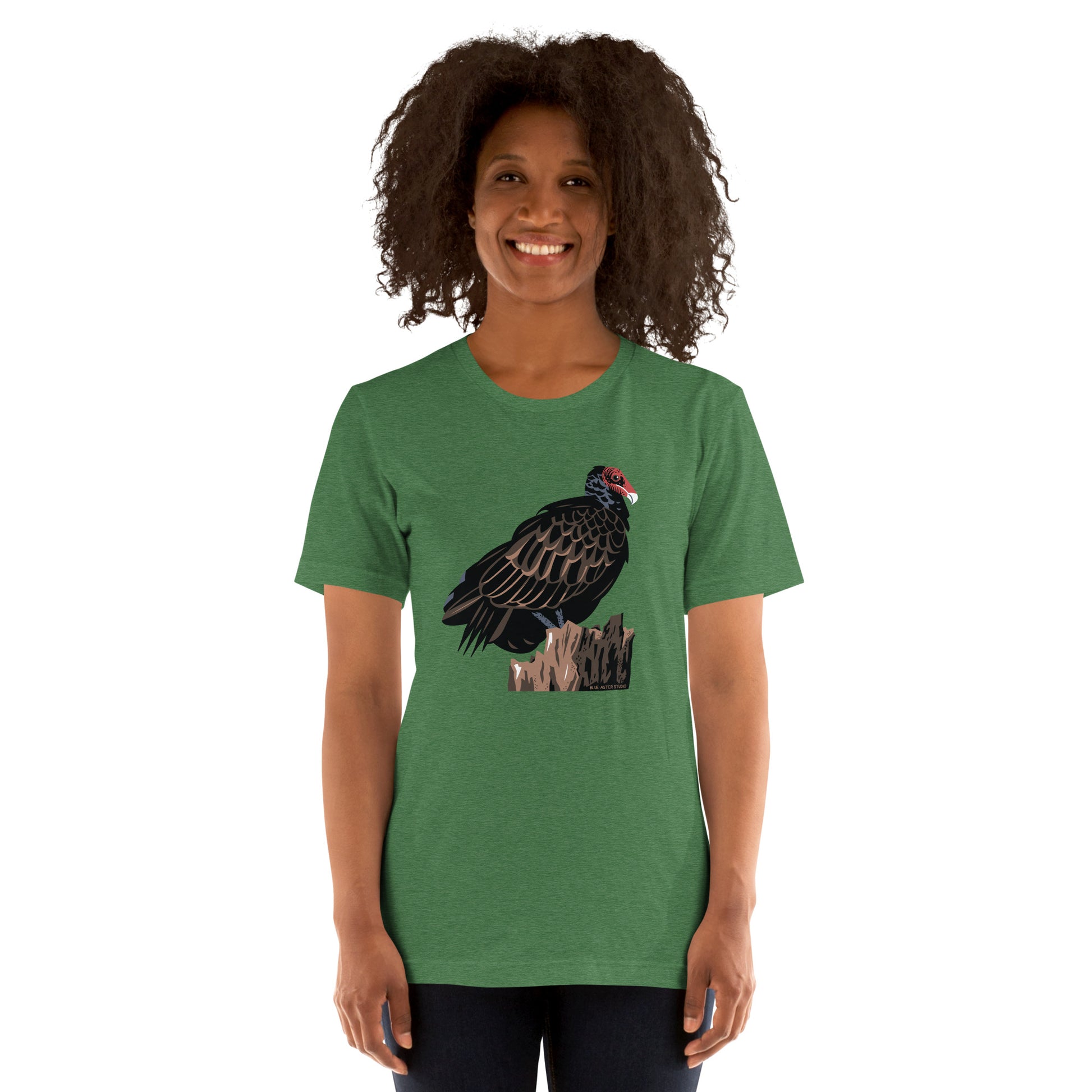 A woman modeling the unisex majestic turkey vulture tee in grass green.