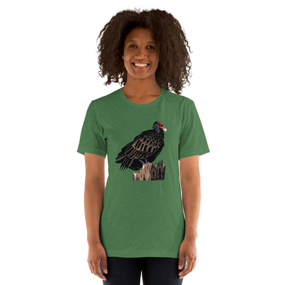 A woman modeling the unisex majestic turkey vulture tee in grass green.