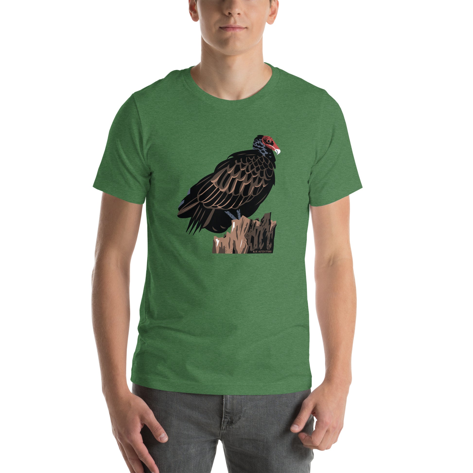 A man wearing the grass green majestic turkey vulture short-sleeved t-shirt.