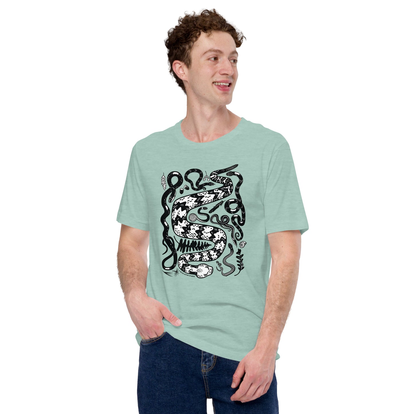 A man modeling the unisex seven snakes t-shirt in dusty blue.