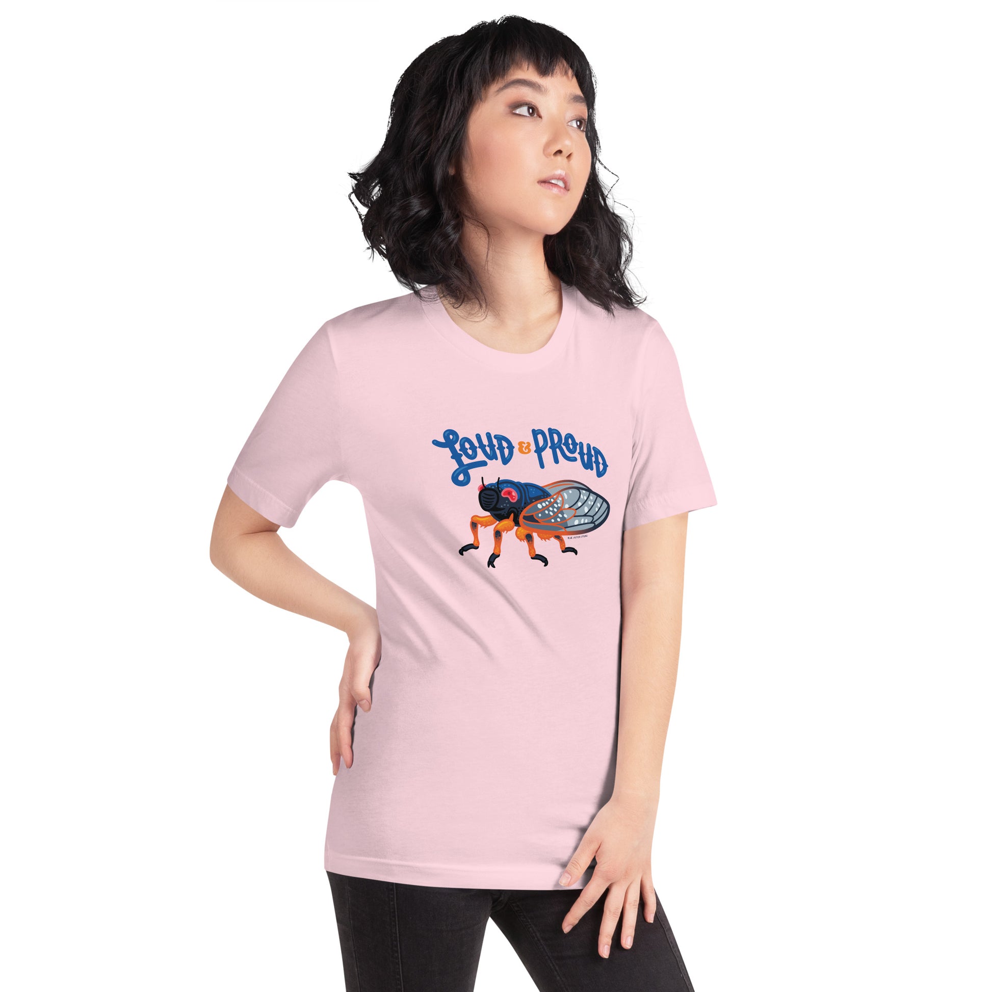 A woman showing off the cicada short-sleeved t-shirt in the soft pink color.